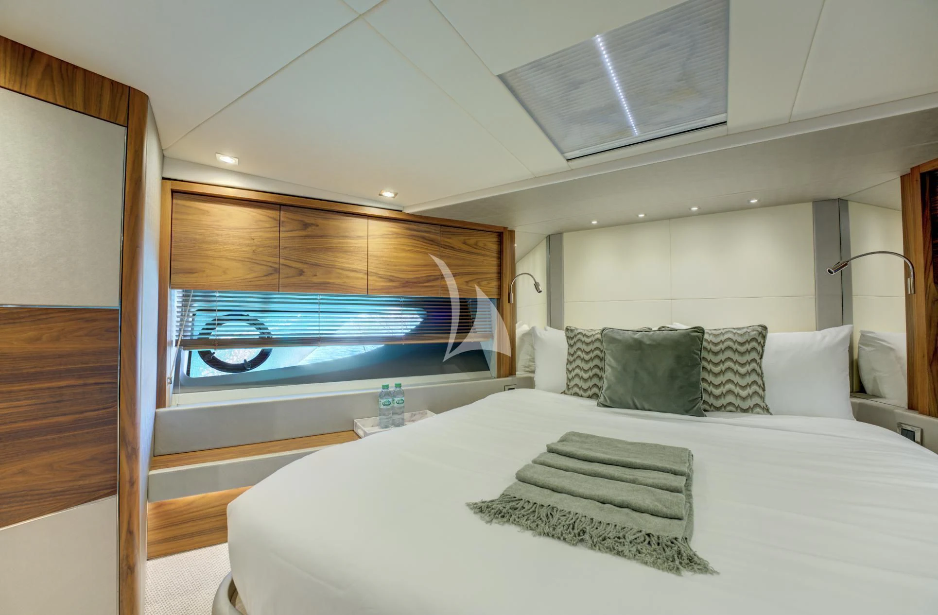a bed with a large window aboard MIKEL ANGELO Yacht for Charter