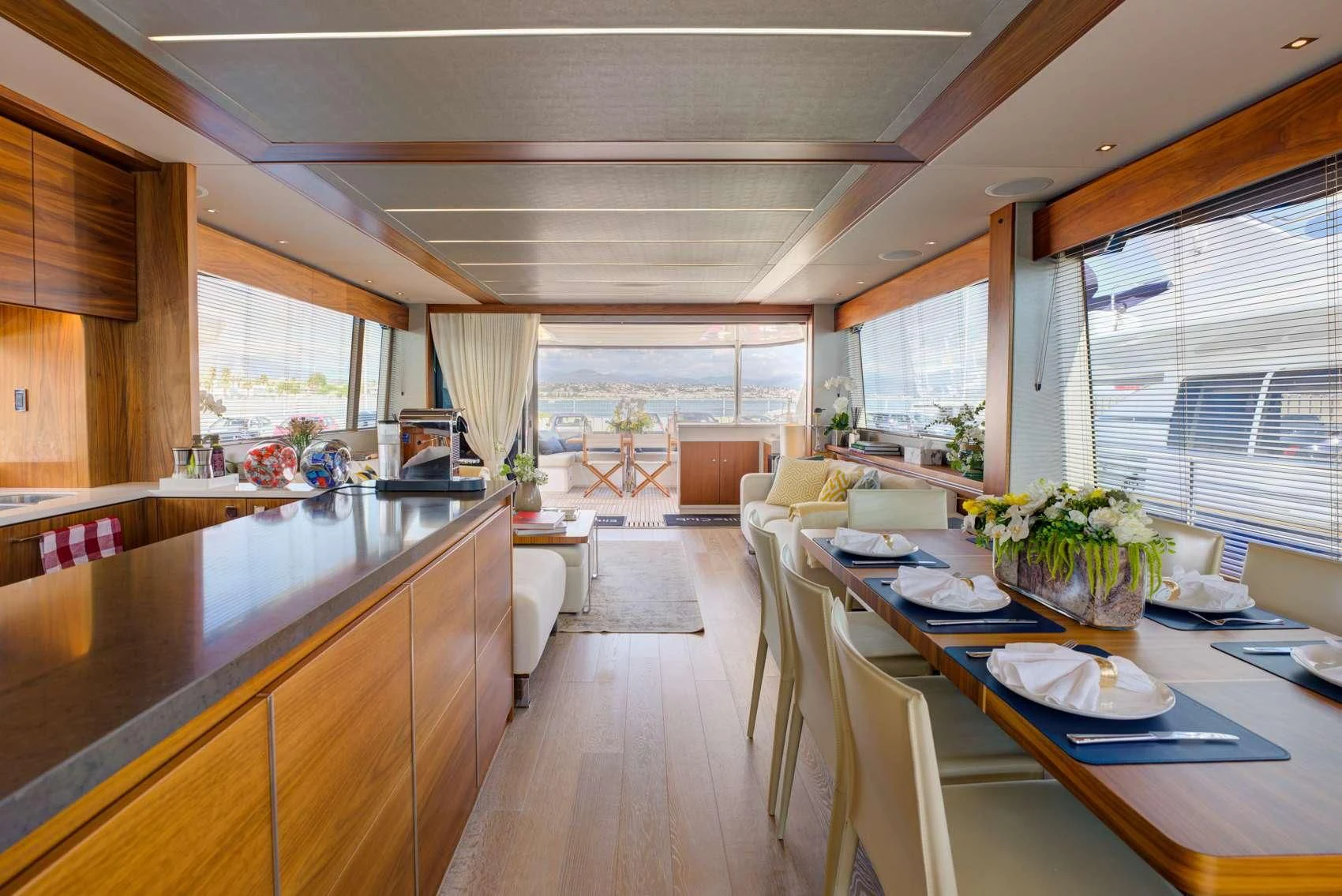 a large kitchen with a dining table aboard MIKEL ANGELO Yacht for Charter