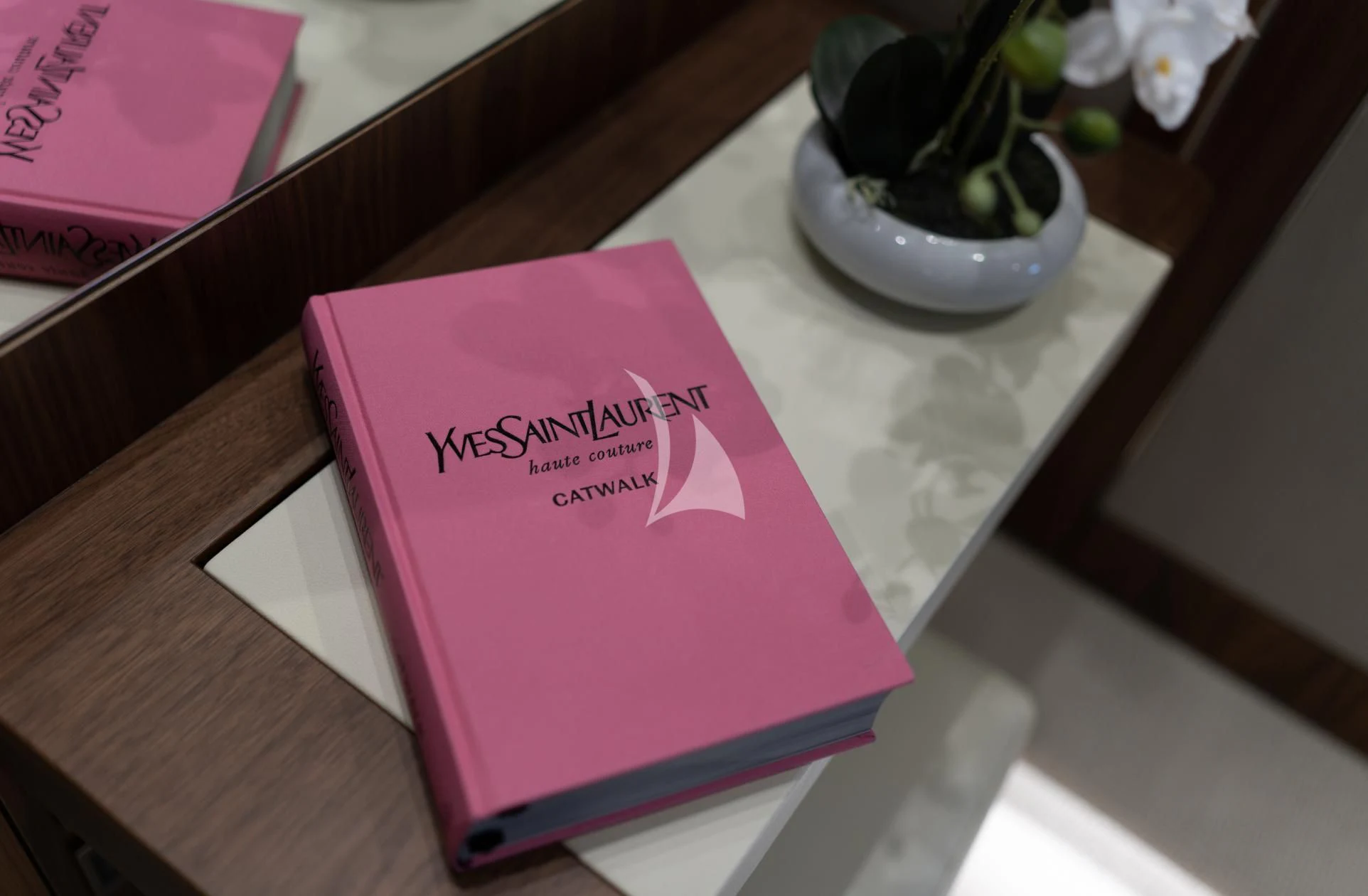 a book on a table aboard MIKEL ANGELO Yacht for Charter