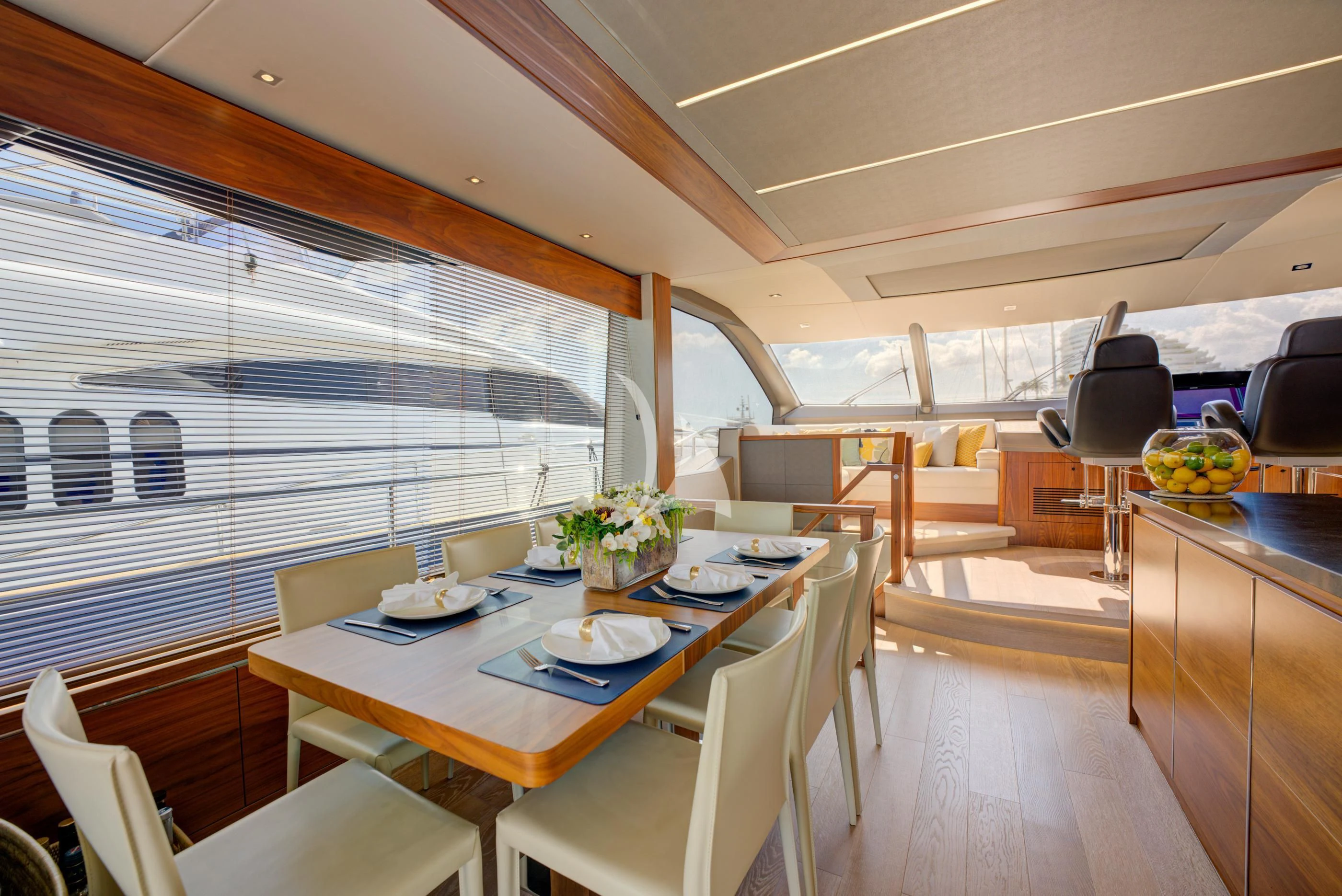 a large room with a table and chairs aboard MIKEL ANGELO Yacht for Charter