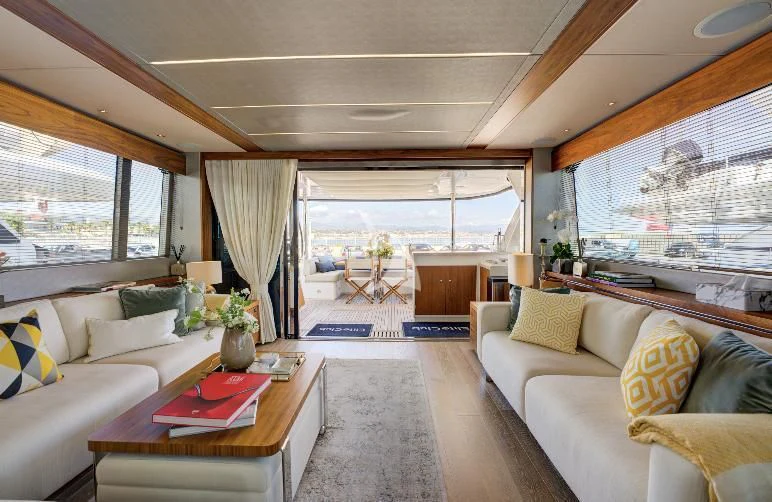 a living room with a large window aboard MIKEL ANGELO Yacht for Charter
