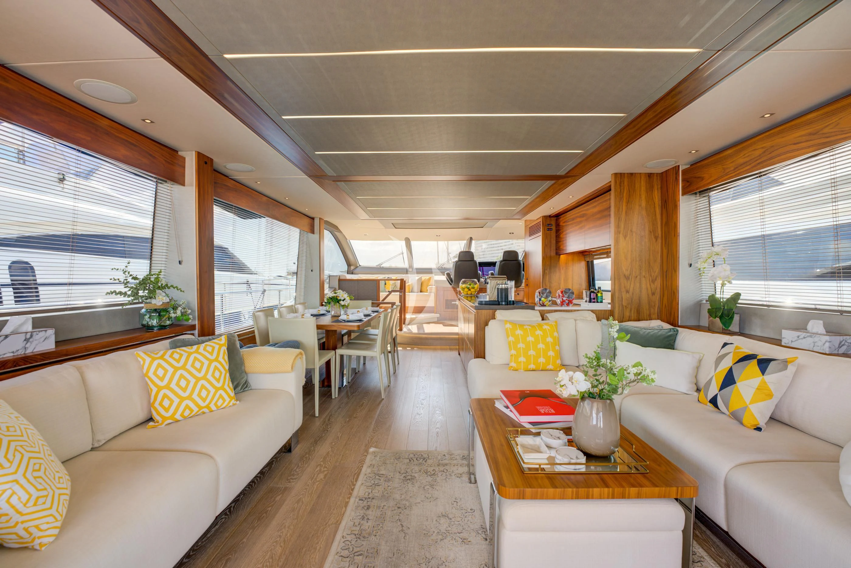 a living room with a couch and a table aboard MIKEL ANGELO Yacht for Charter