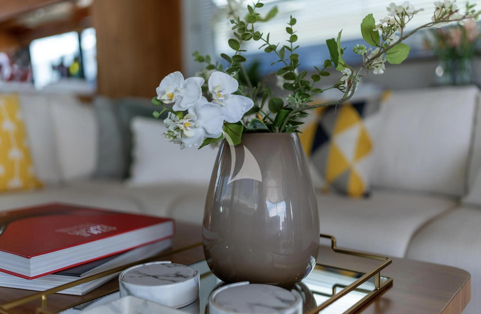 a vase of flowers on a table aboard MIKEL ANGELO Yacht for Charter