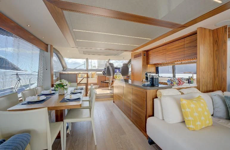 a living room with a couch and a table aboard MIKEL ANGELO Yacht for Charter