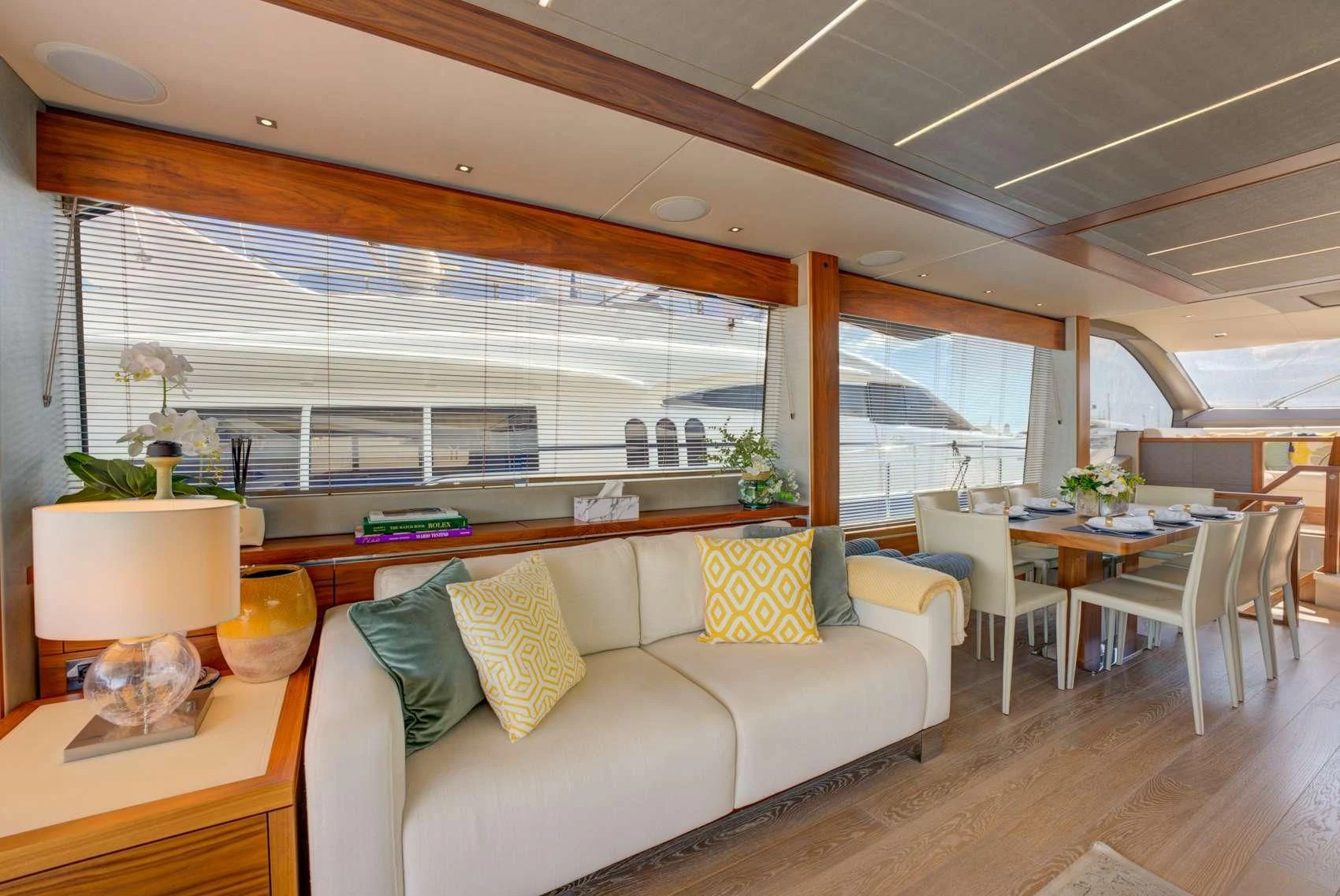 a living room with a couch and a table aboard MIKEL ANGELO Yacht for Charter