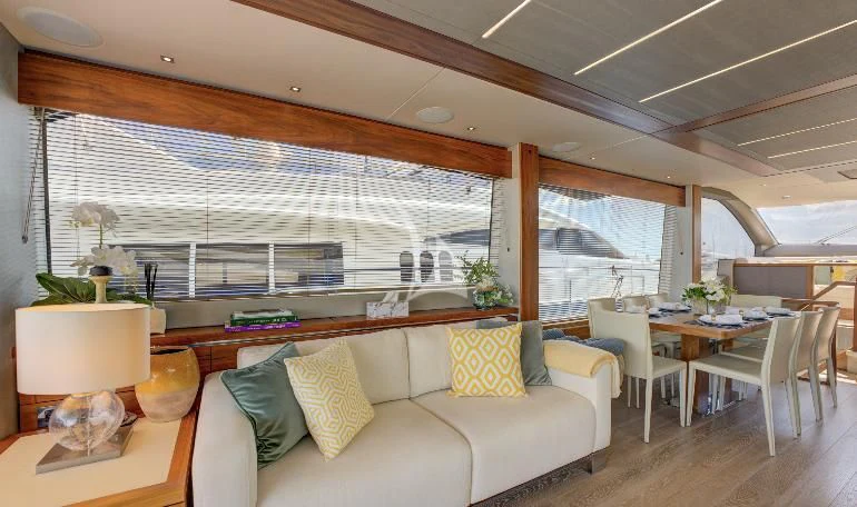 a living room with a large window aboard MIKEL ANGELO Yacht for Charter