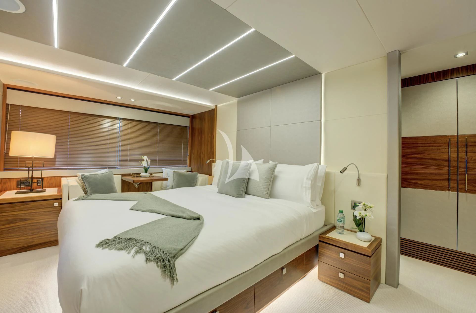 a bedroom with a bed and a desk aboard MIKEL ANGELO Yacht for Charter