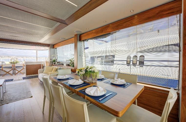 a dining table in a room aboard MIKEL ANGELO Yacht for Charter