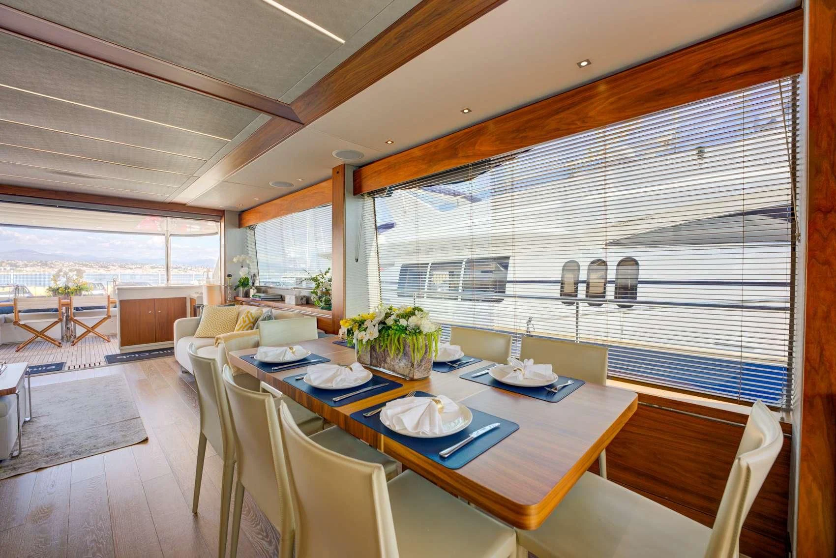 a large dining room with a large window aboard MIKEL ANGELO Yacht for Charter