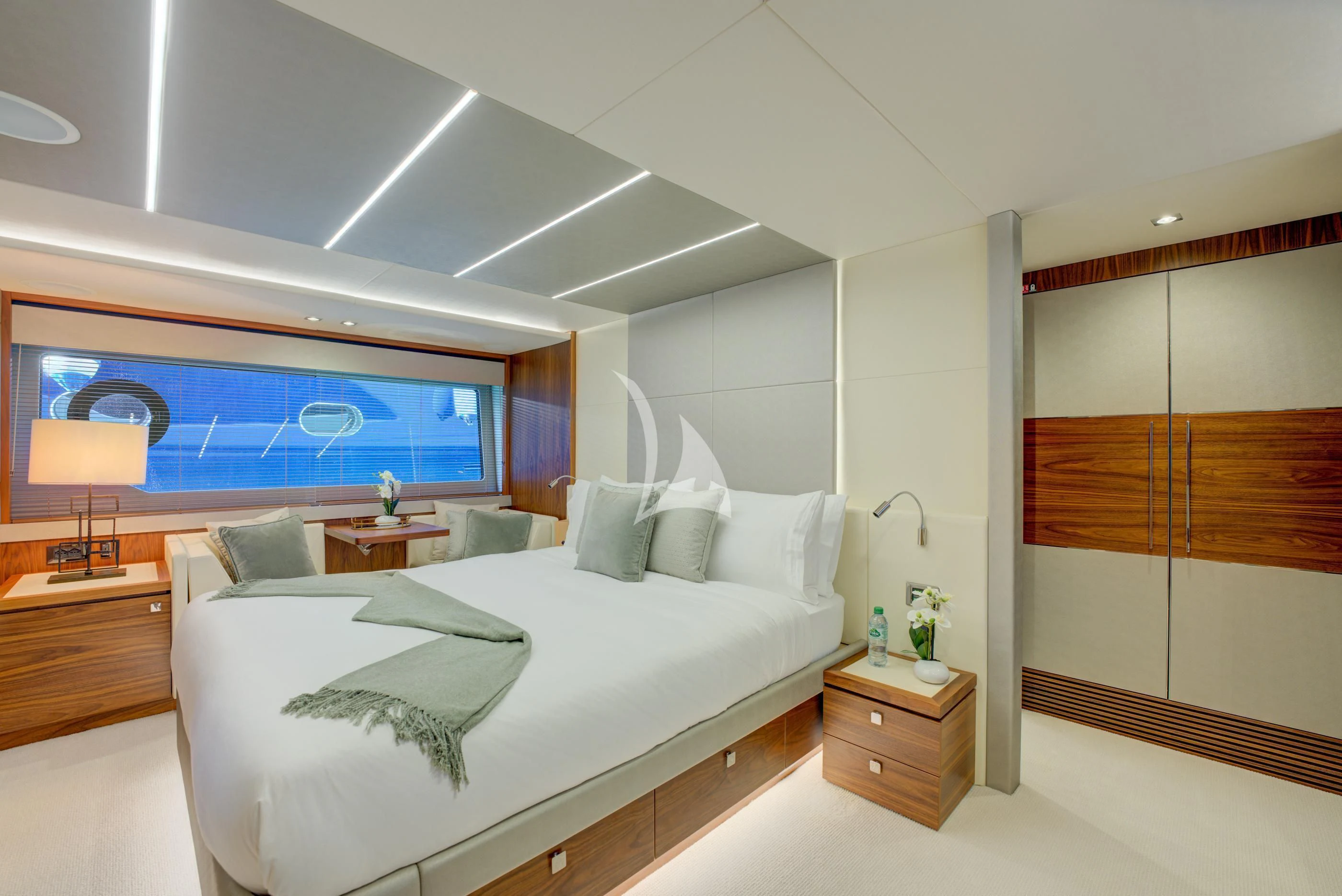 a bedroom with a bed and a tv aboard MIKEL ANGELO Yacht for Charter