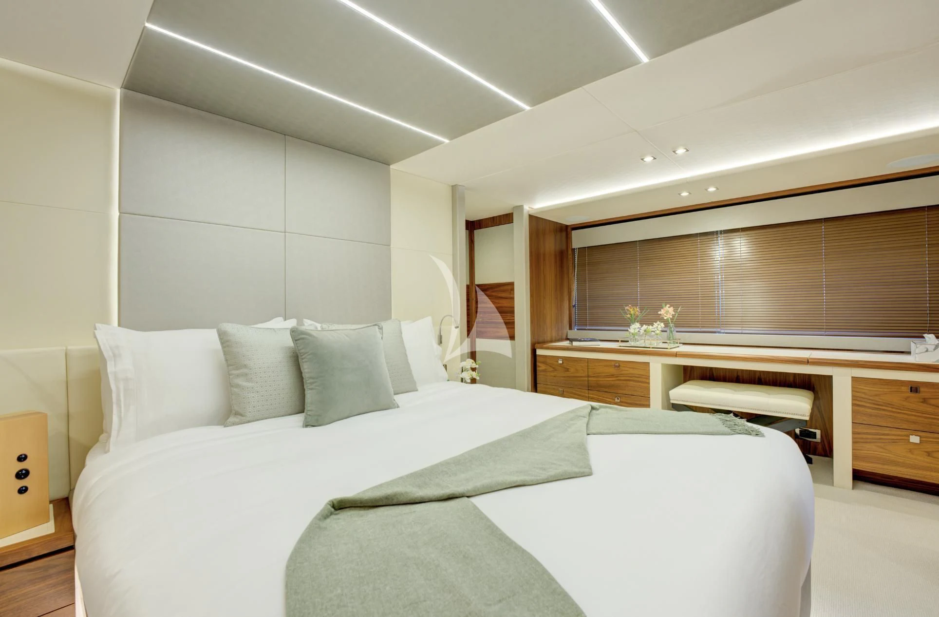 a room with a bed and a desk aboard MIKEL ANGELO Yacht for Charter