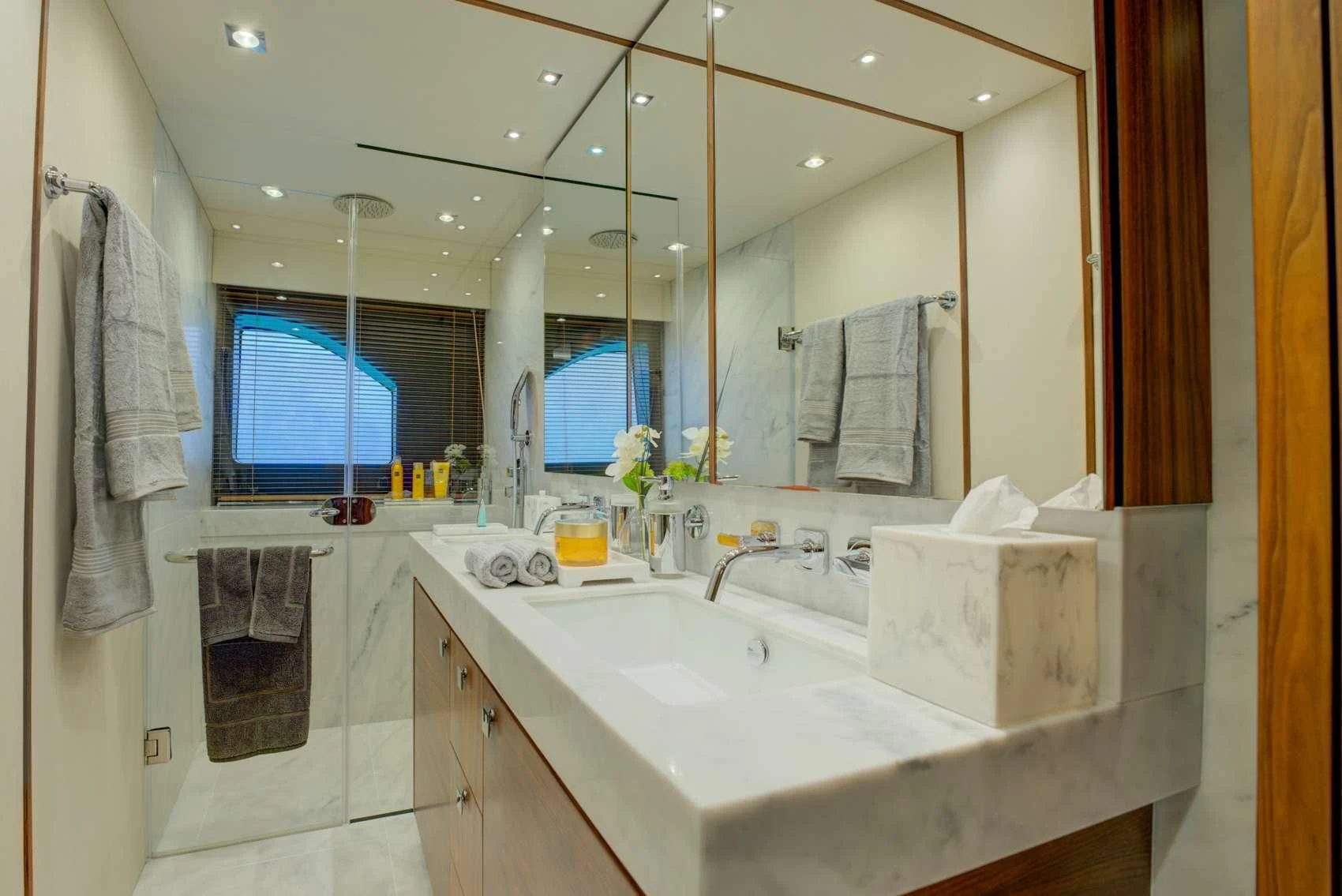 a bathroom with a sink and towels aboard MIKEL ANGELO Yacht for Charter