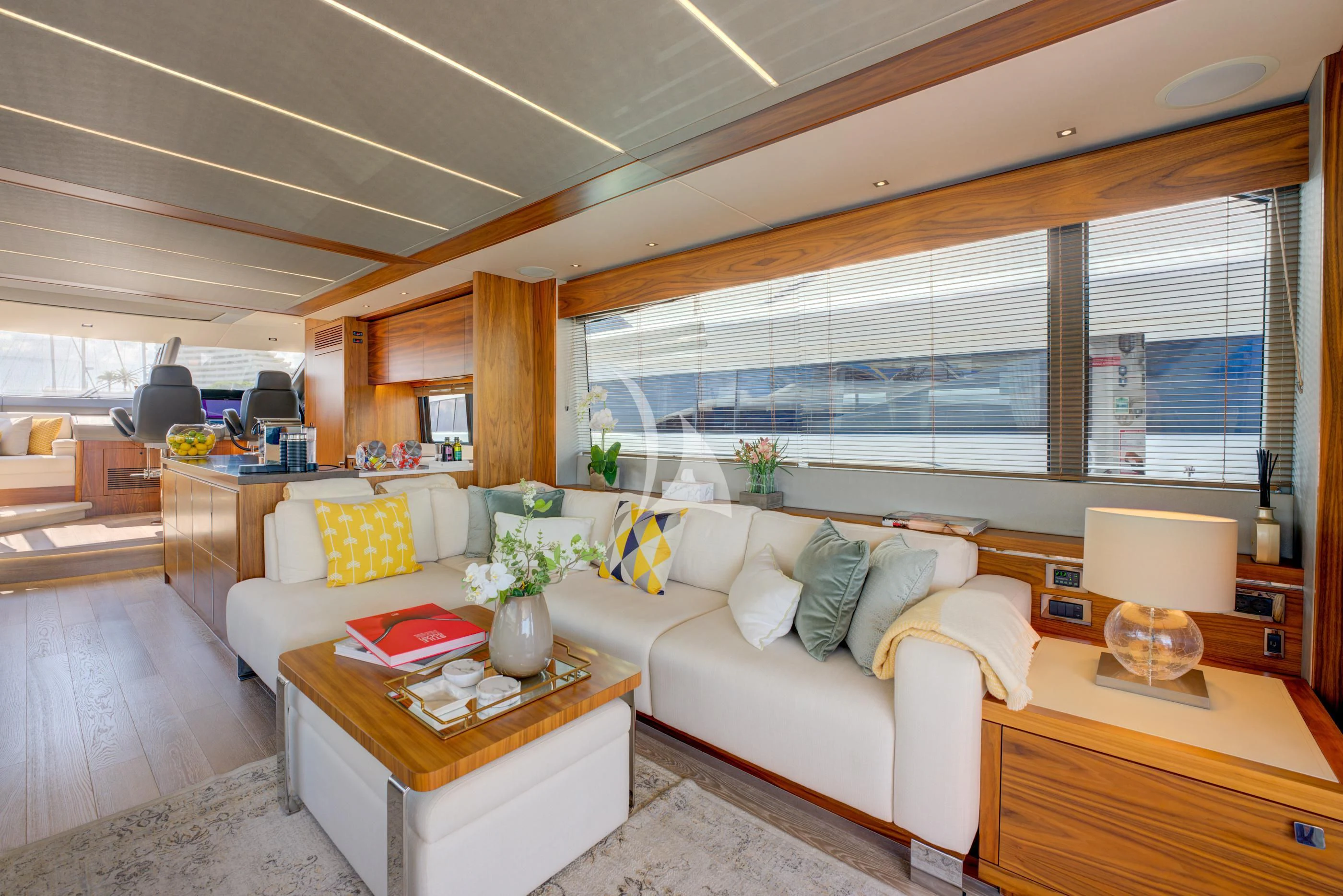 a living room with a large window aboard MIKEL ANGELO Yacht for Charter