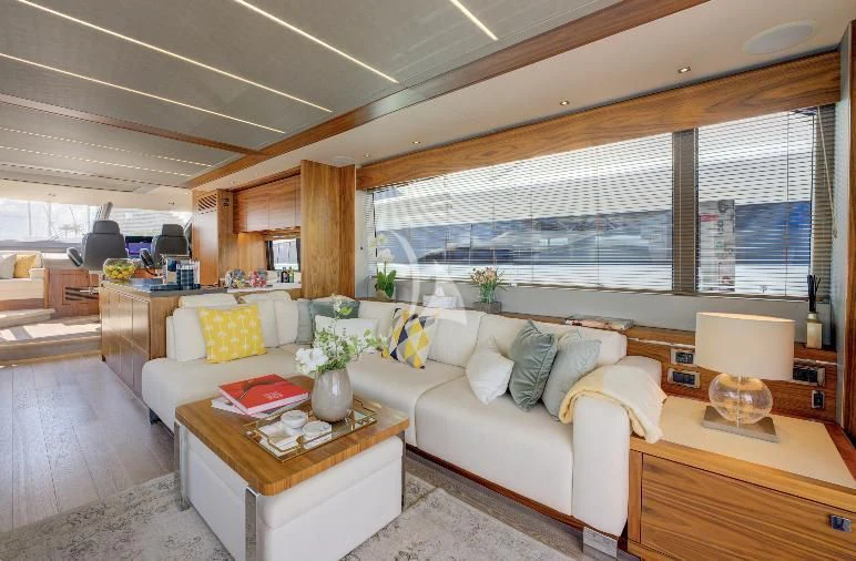 a living room with a large window aboard MIKEL ANGELO Yacht for Charter