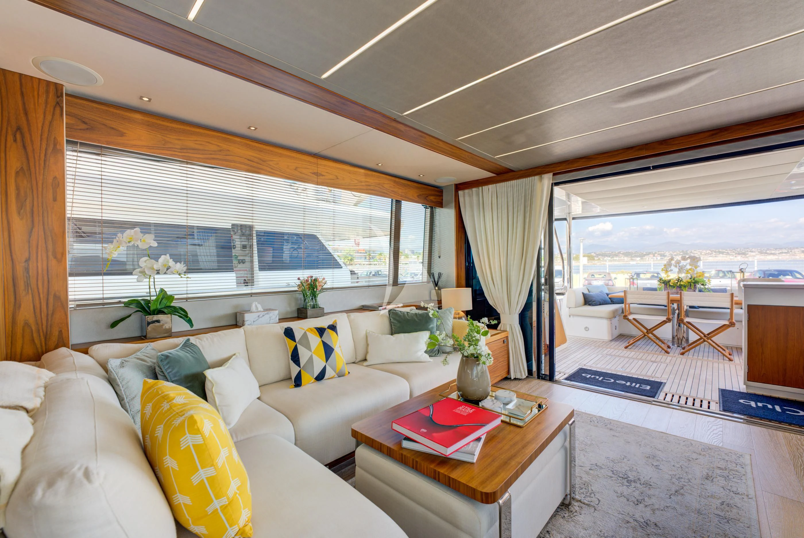 a living room with a couch and a table aboard MIKEL ANGELO Yacht for Charter
