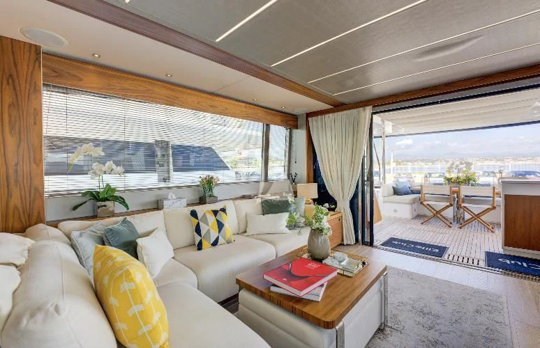a living room with a large window aboard MIKEL ANGELO Yacht for Charter