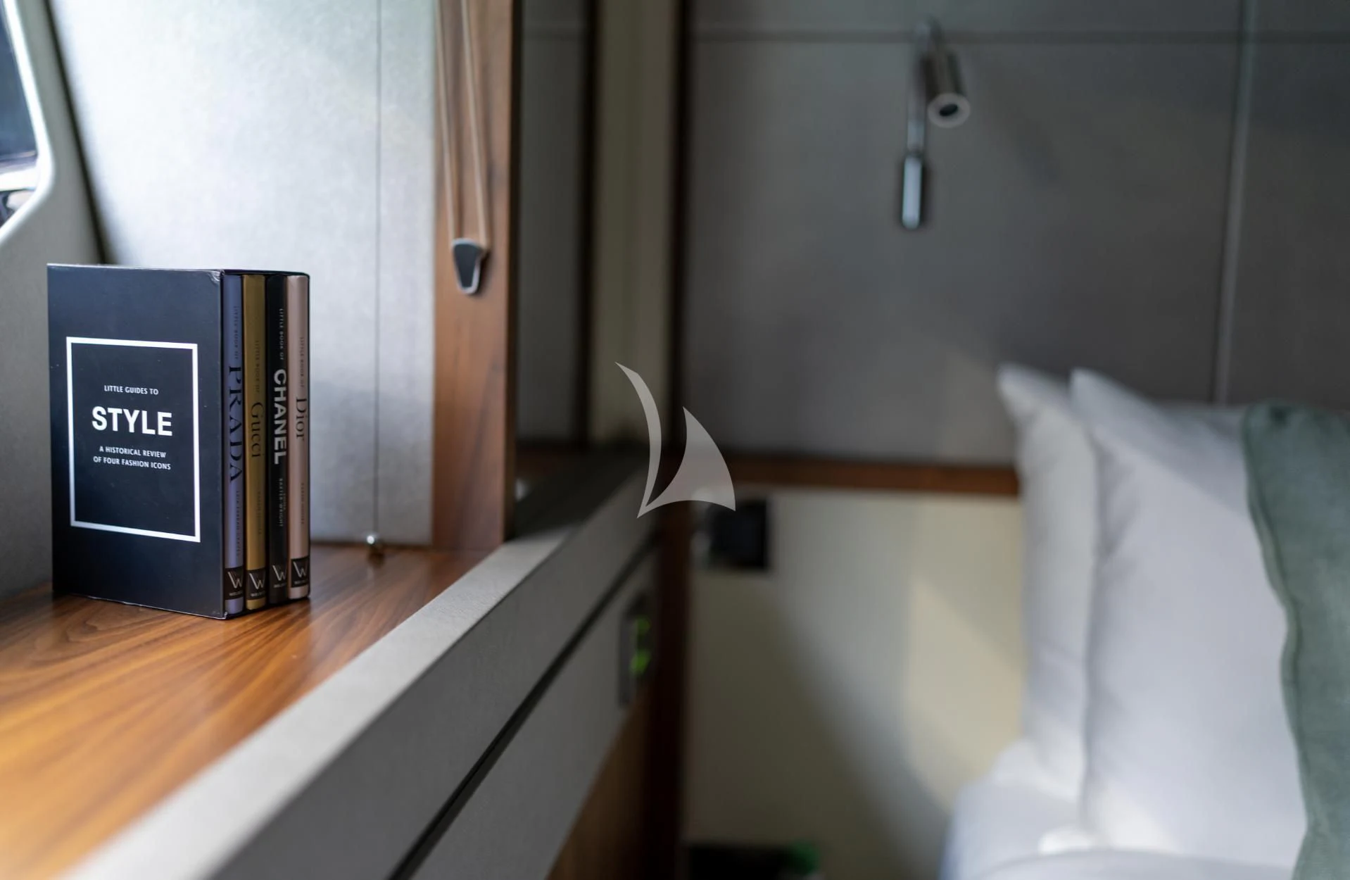 a book on a table aboard MIKEL ANGELO Yacht for Charter