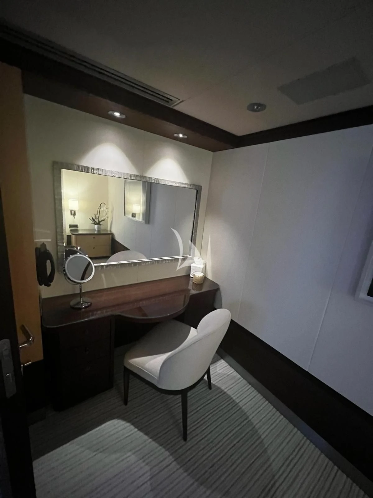 a bathroom with a white chair aboard BELLA Yacht for Sale