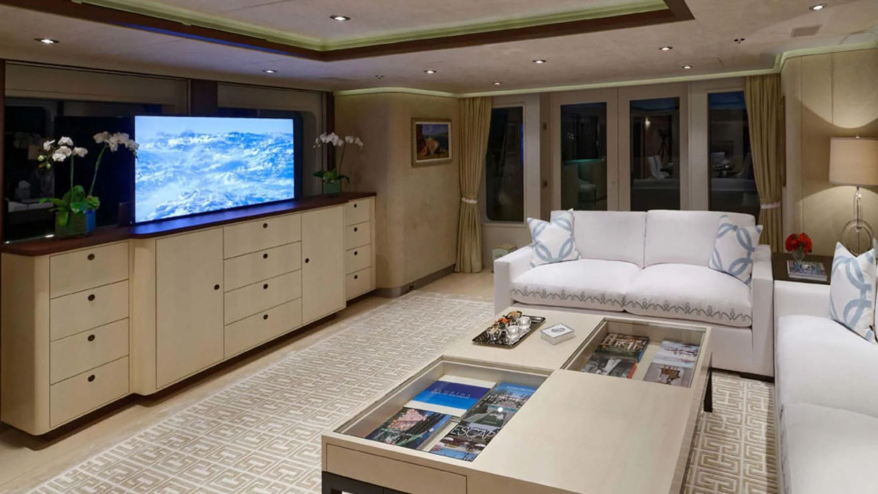 a living room with a large window aboard BELLA Yacht for Sale