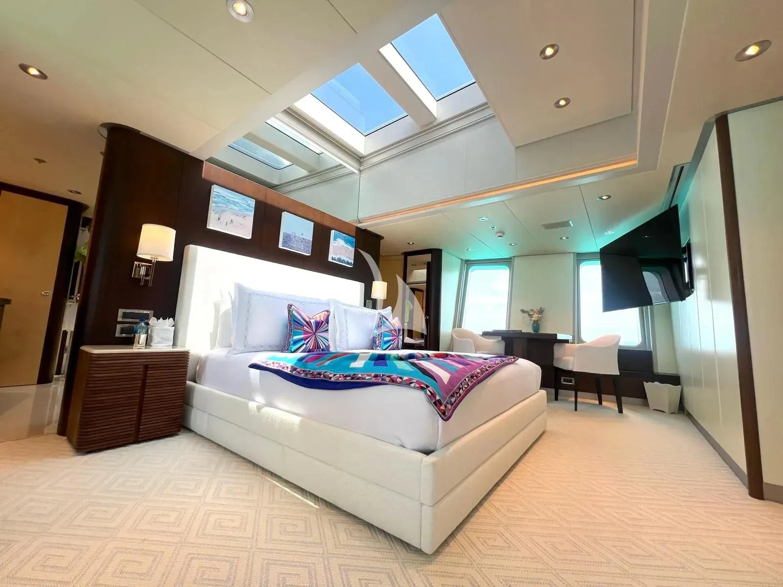 a large bedroom with a large bed aboard BELLA Yacht for Sale