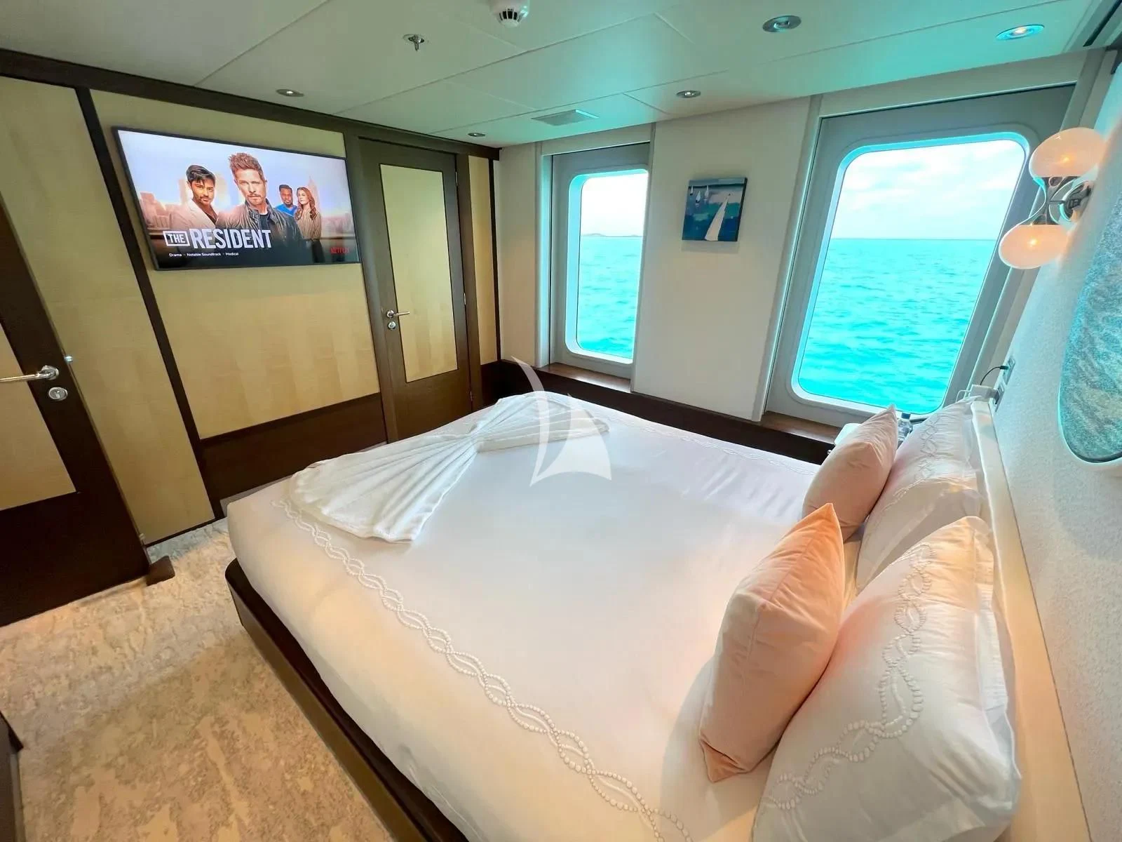 a bed in a room aboard BELLA Yacht for Sale
