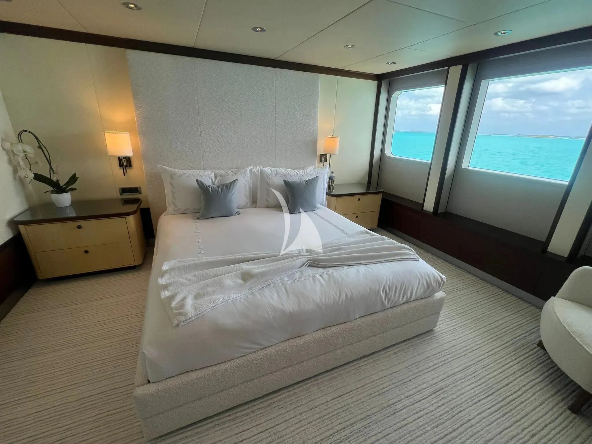a bedroom with a large bed aboard BELLA Yacht for Sale