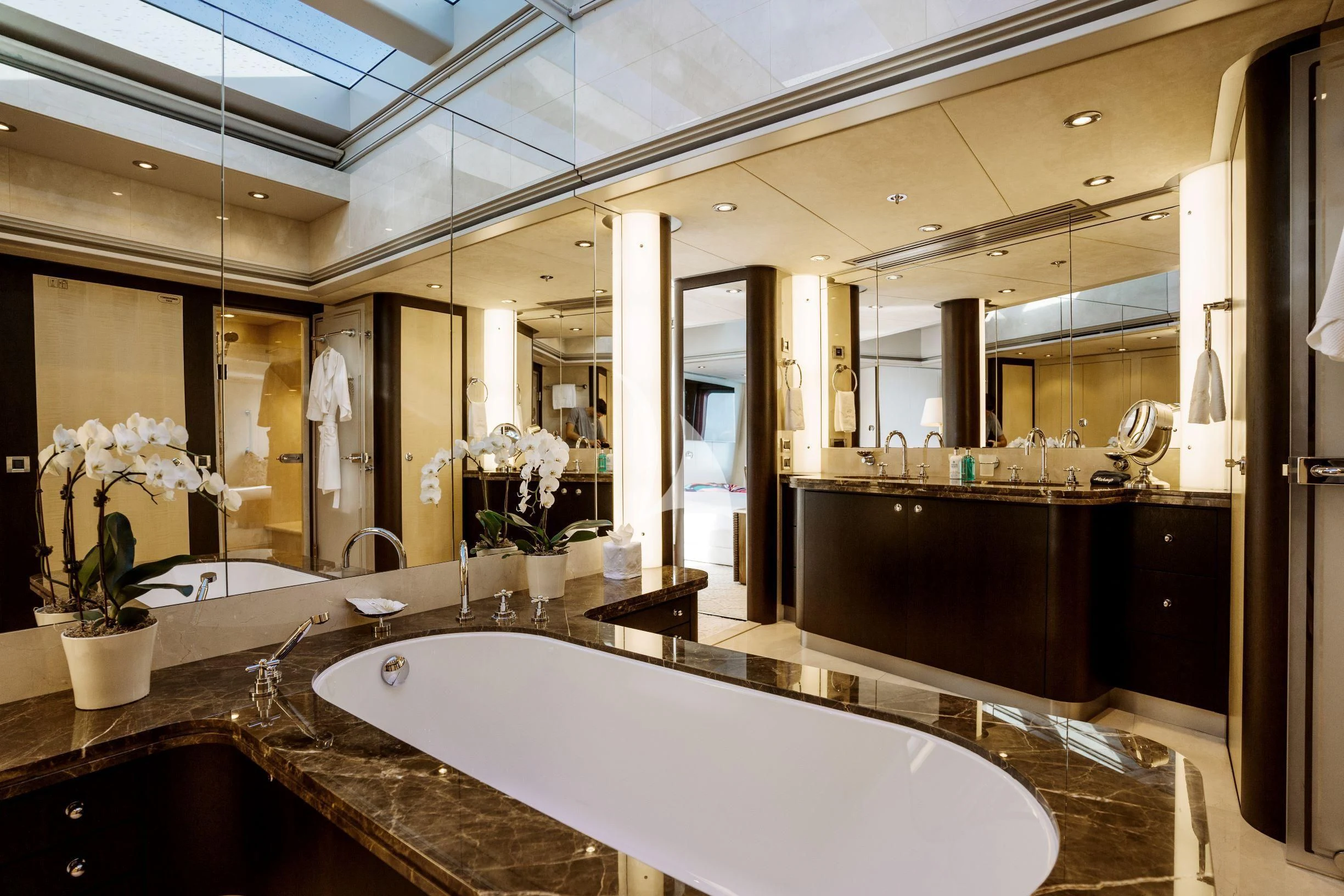 a large bathroom with a large mirror aboard BELLA Yacht for Sale