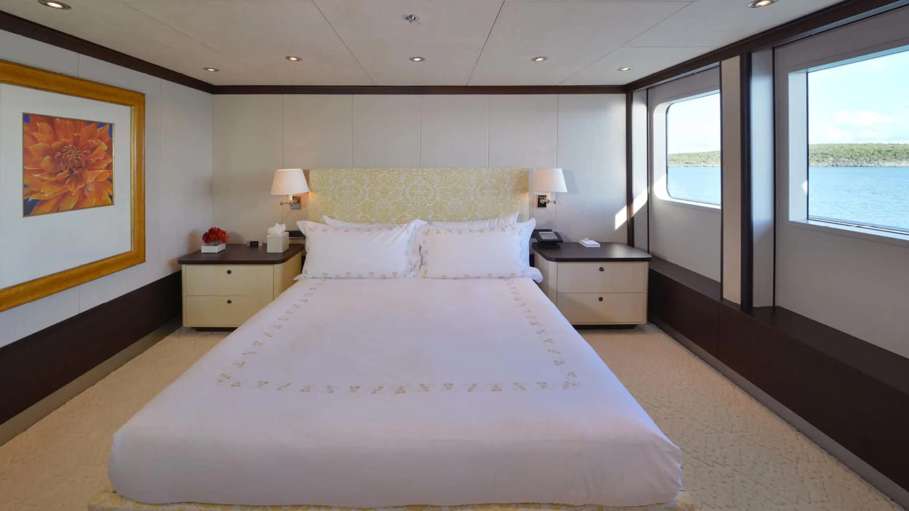 a large bed in a room aboard BELLA Yacht for Sale