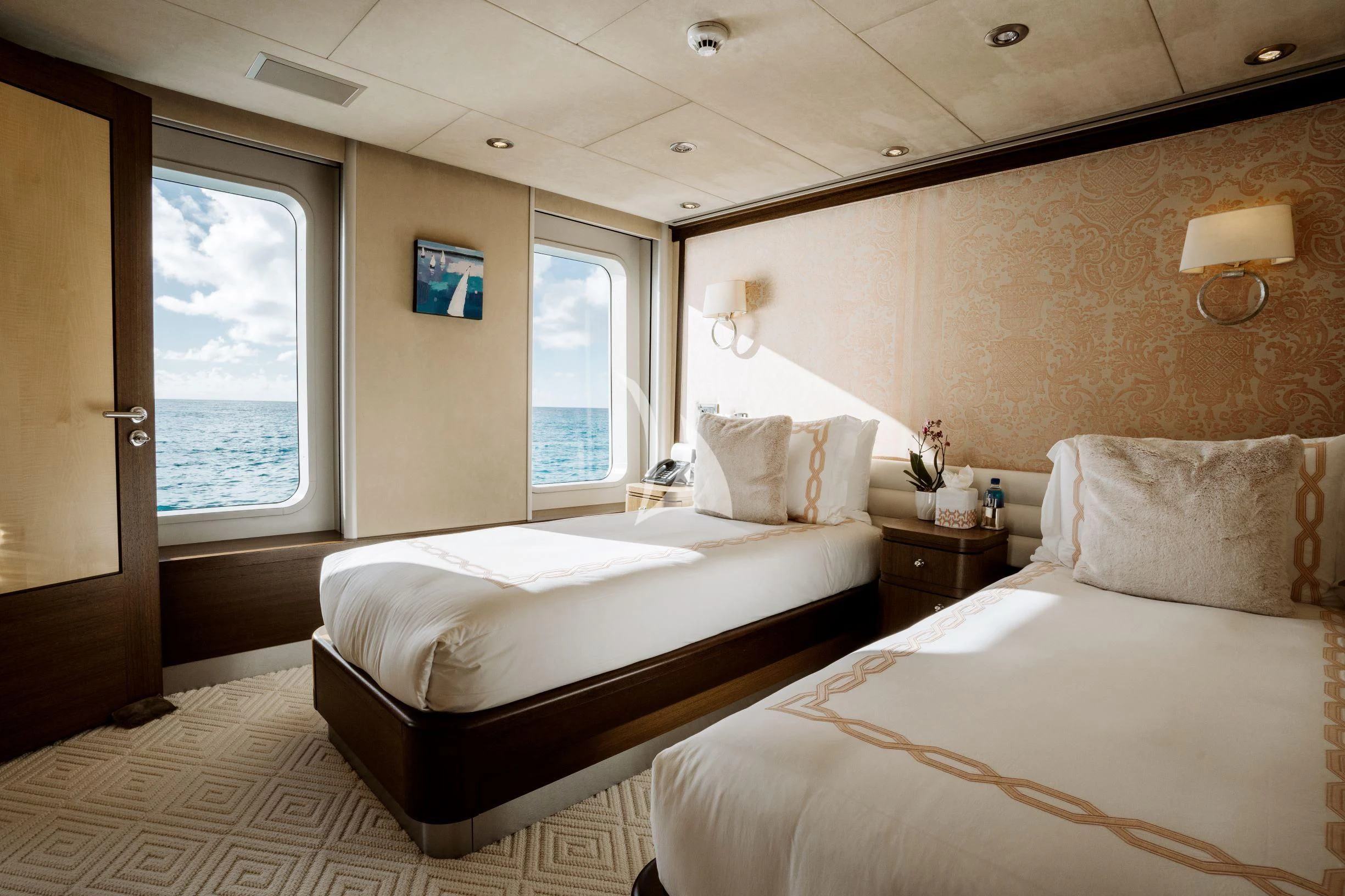 a couple of beds in a hotel room aboard BELLA Yacht for Sale