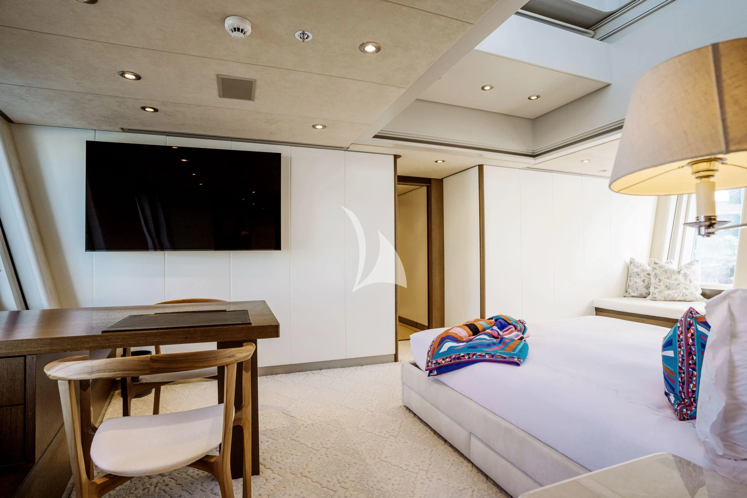 a bedroom with a bed and a tv aboard BELLA Yacht for Sale