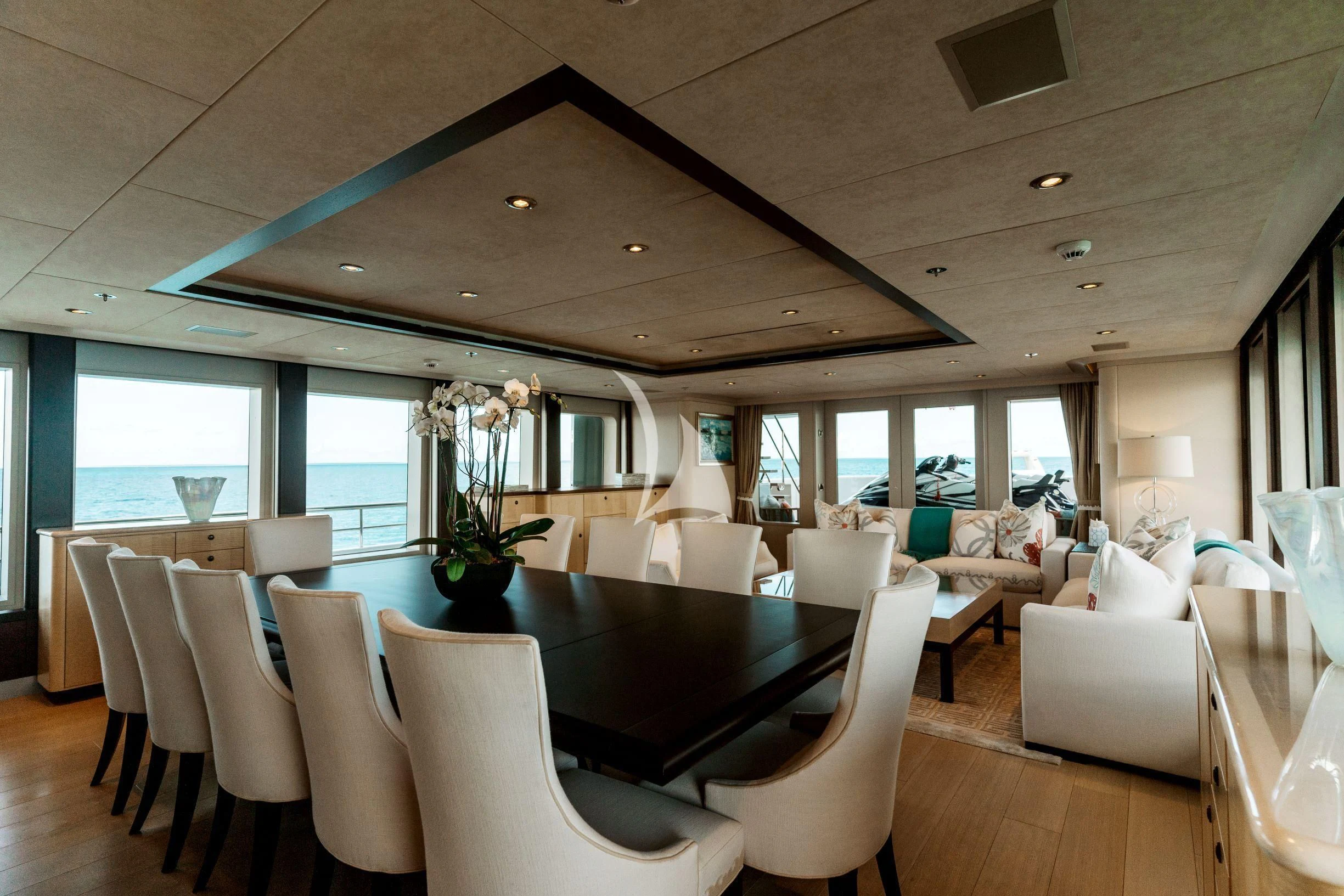a large room with a table and chairs aboard BELLA Yacht for Sale