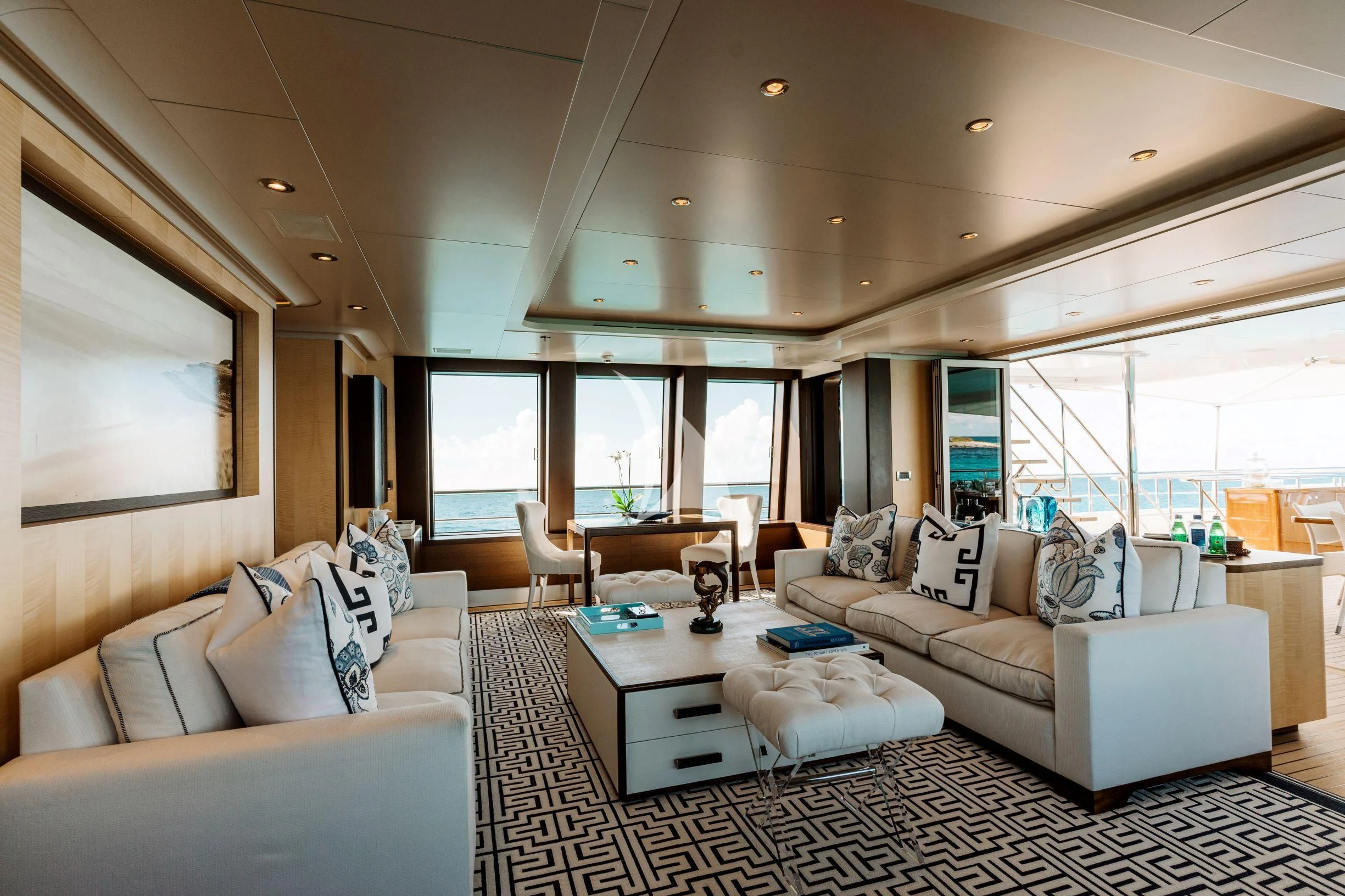a living room with a large window aboard BELLA Yacht for Sale