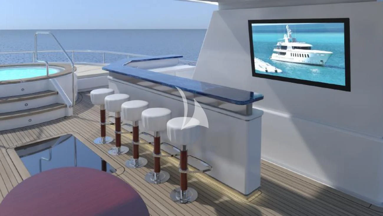 a pool table with stools and a television on a wall aboard BELLA Yacht for Sale