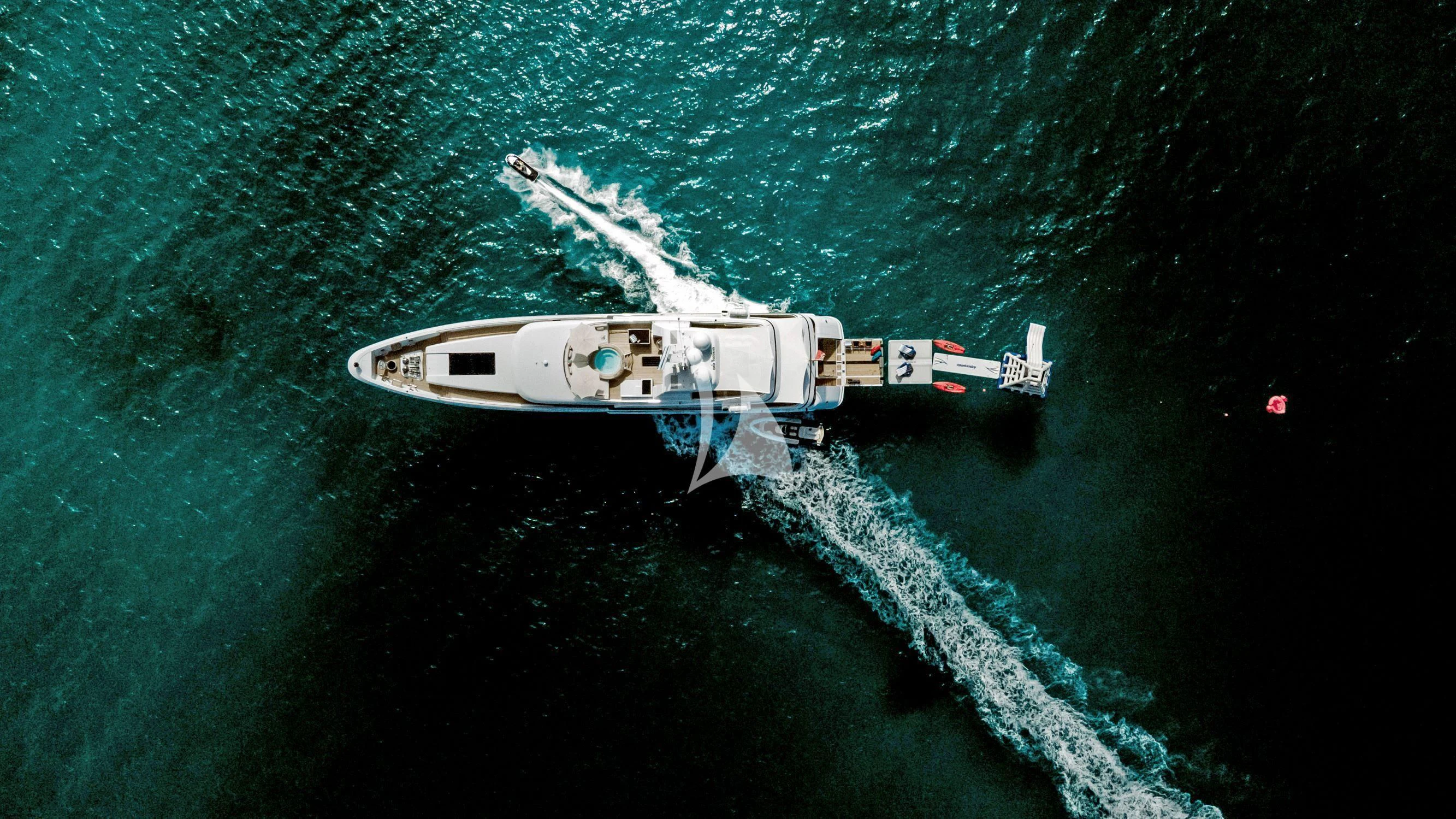 a helicopter flying over a body of water aboard BELLA Yacht for Sale