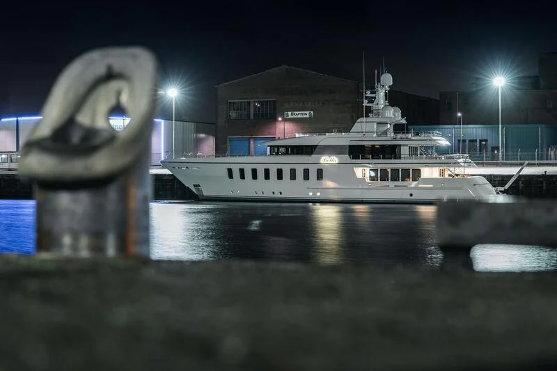 a white boat in a harbor aboard BELLA Yacht for Sale