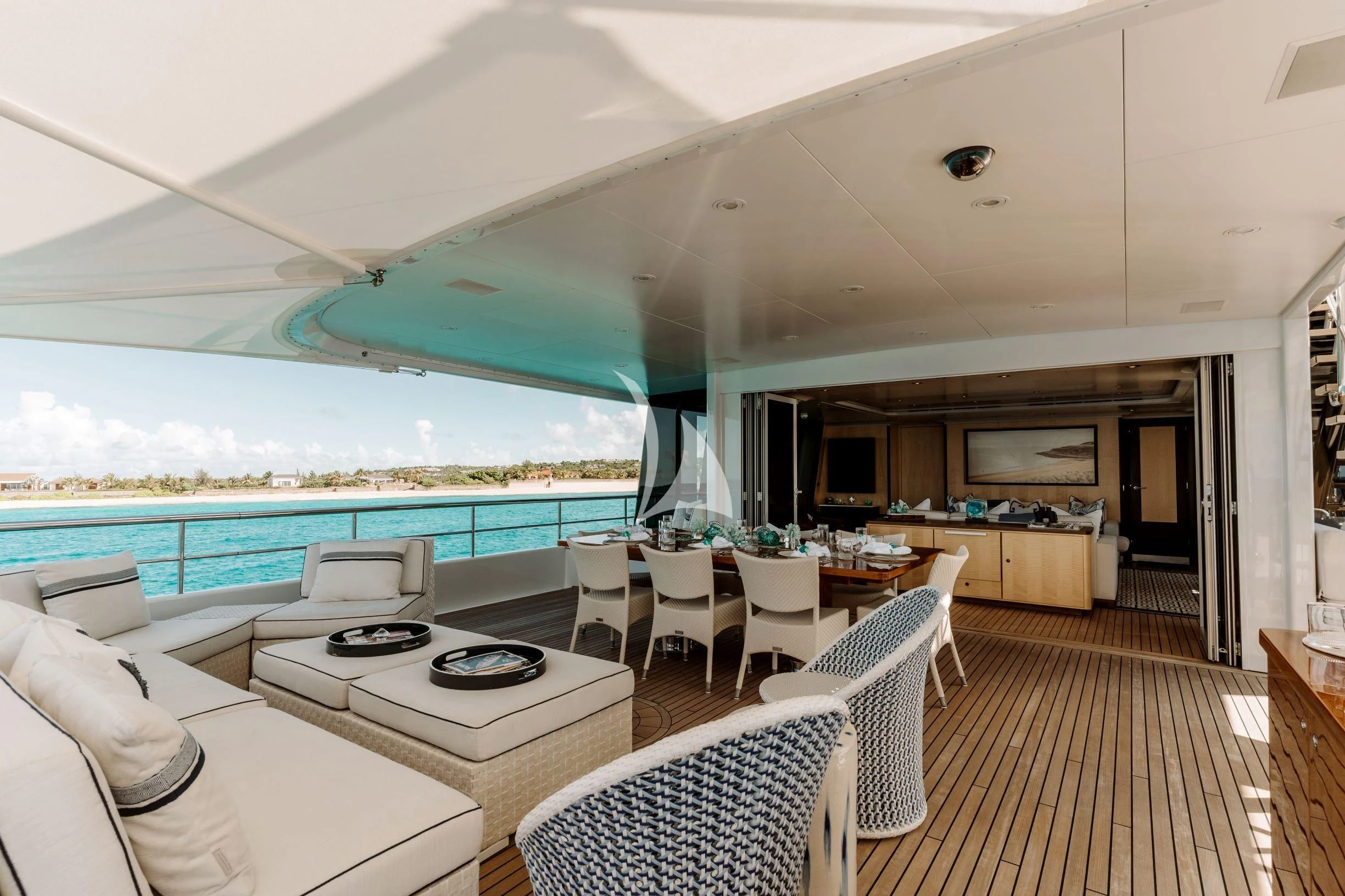 a large living room with a large balcony aboard BELLA Yacht for Sale