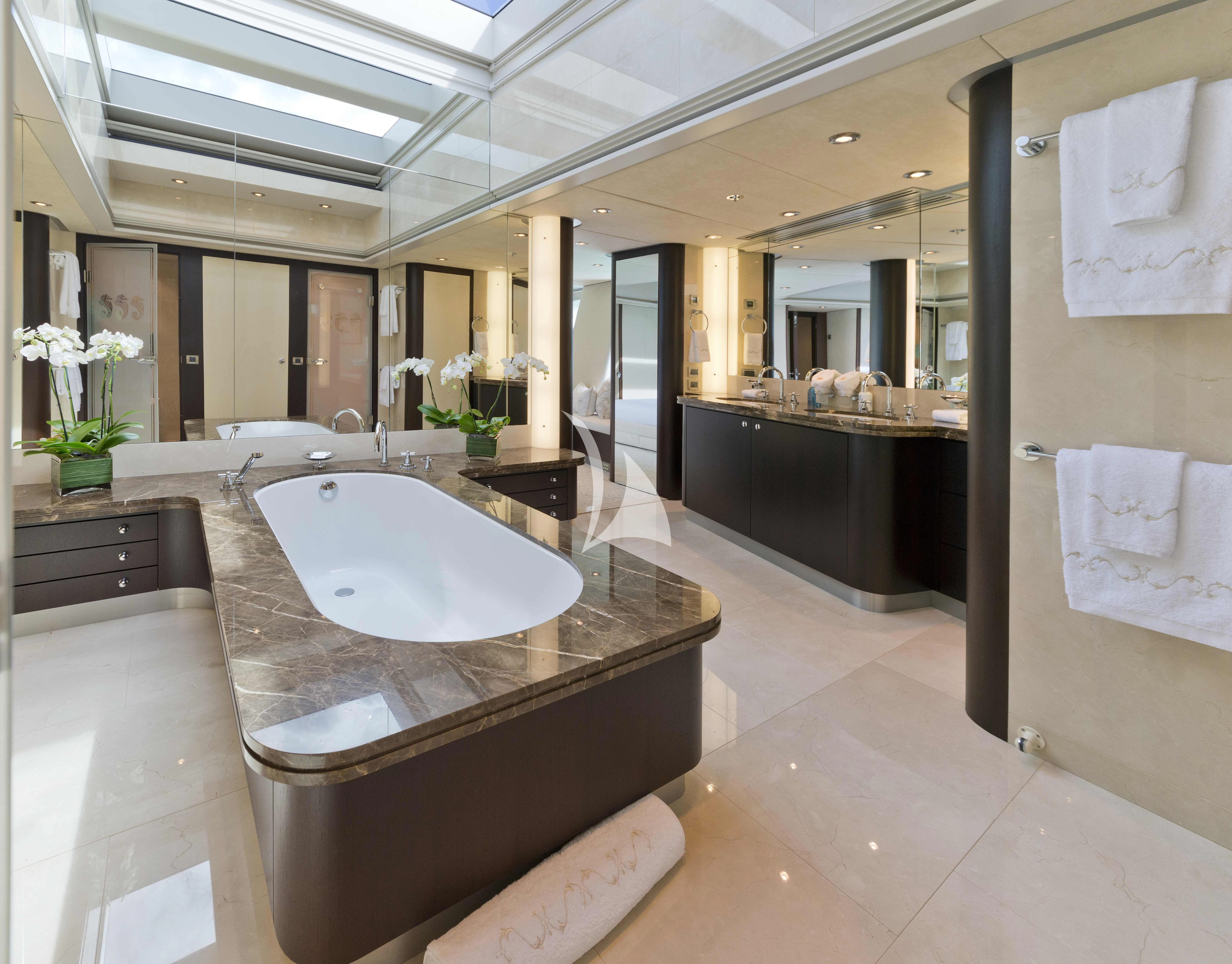 a large bathroom with a large bathtub aboard BELLA Yacht for Sale