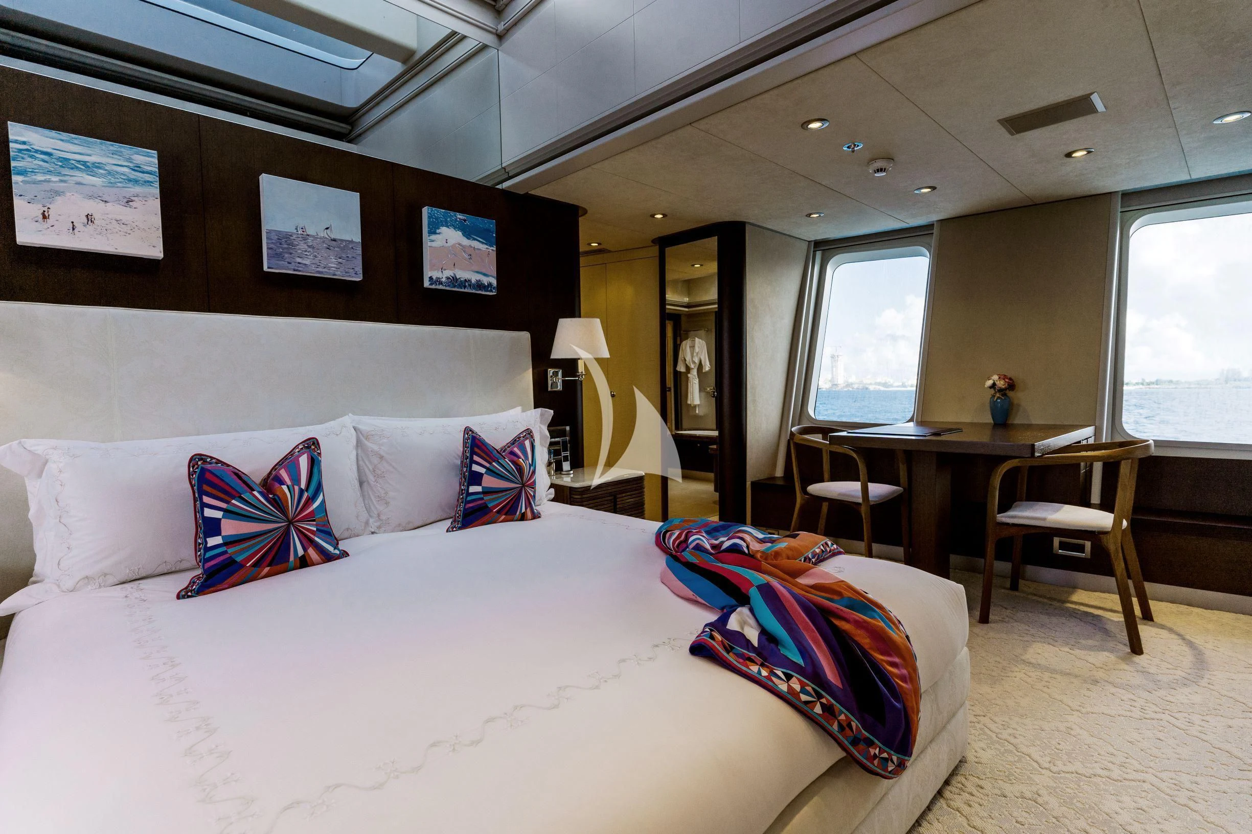 a hotel room with a bed and a table aboard BELLA Yacht for Sale