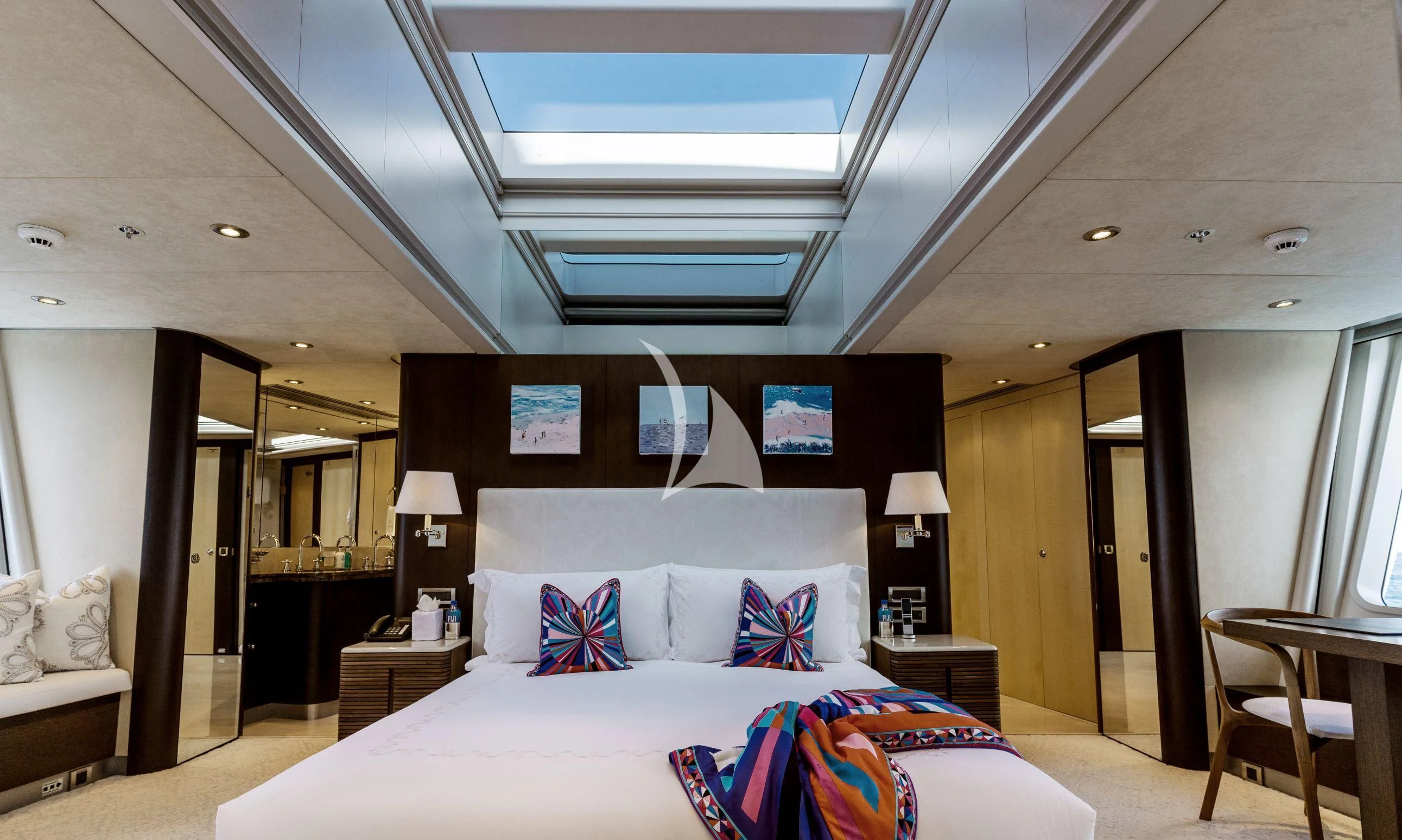 a hotel room with a bed and a desk aboard BELLA Yacht for Sale