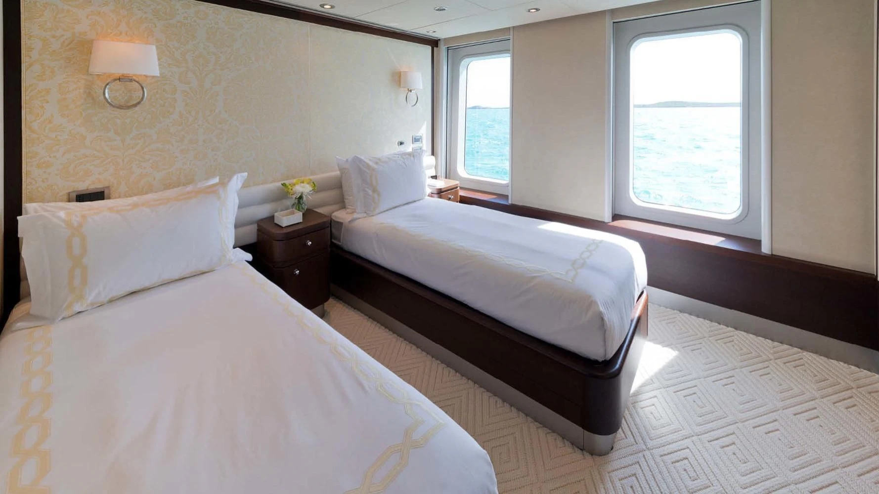 a couple of beds in a hotel room aboard BELLA Yacht for Sale