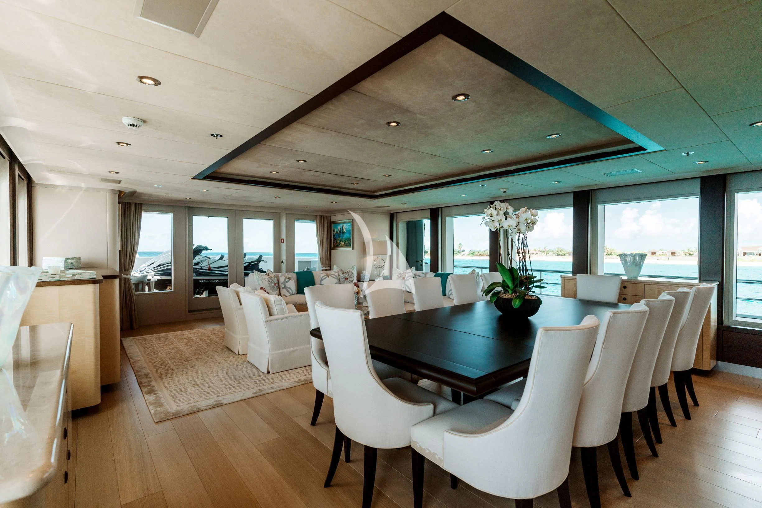 a large room with tables and chairs aboard BELLA Yacht for Sale