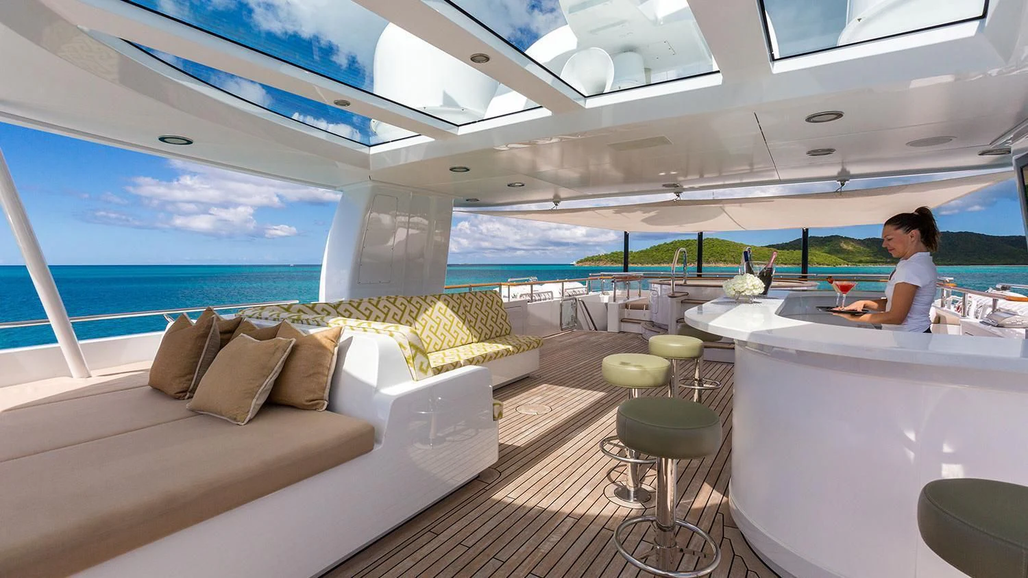 a person sitting at a table on a boat aboard MICHAELA ROSE Yacht for Sale
