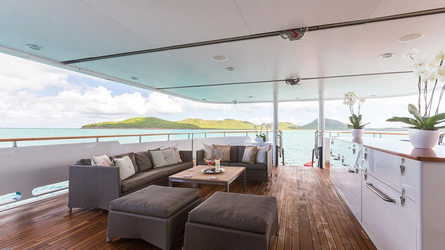 a living room with a large window aboard MICHAELA ROSE Yacht for Sale