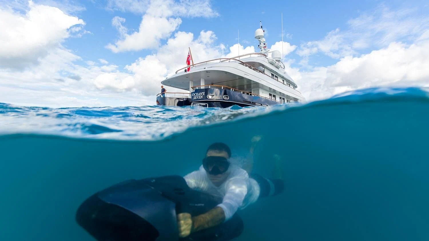 a man and a woman in a boat in the water aboard MICHAELA ROSE Yacht for Sale