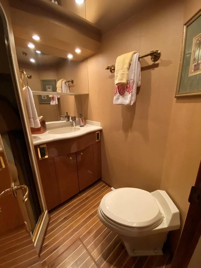 a bathroom with a toilet and sink aboard PITTY Yacht for Sale