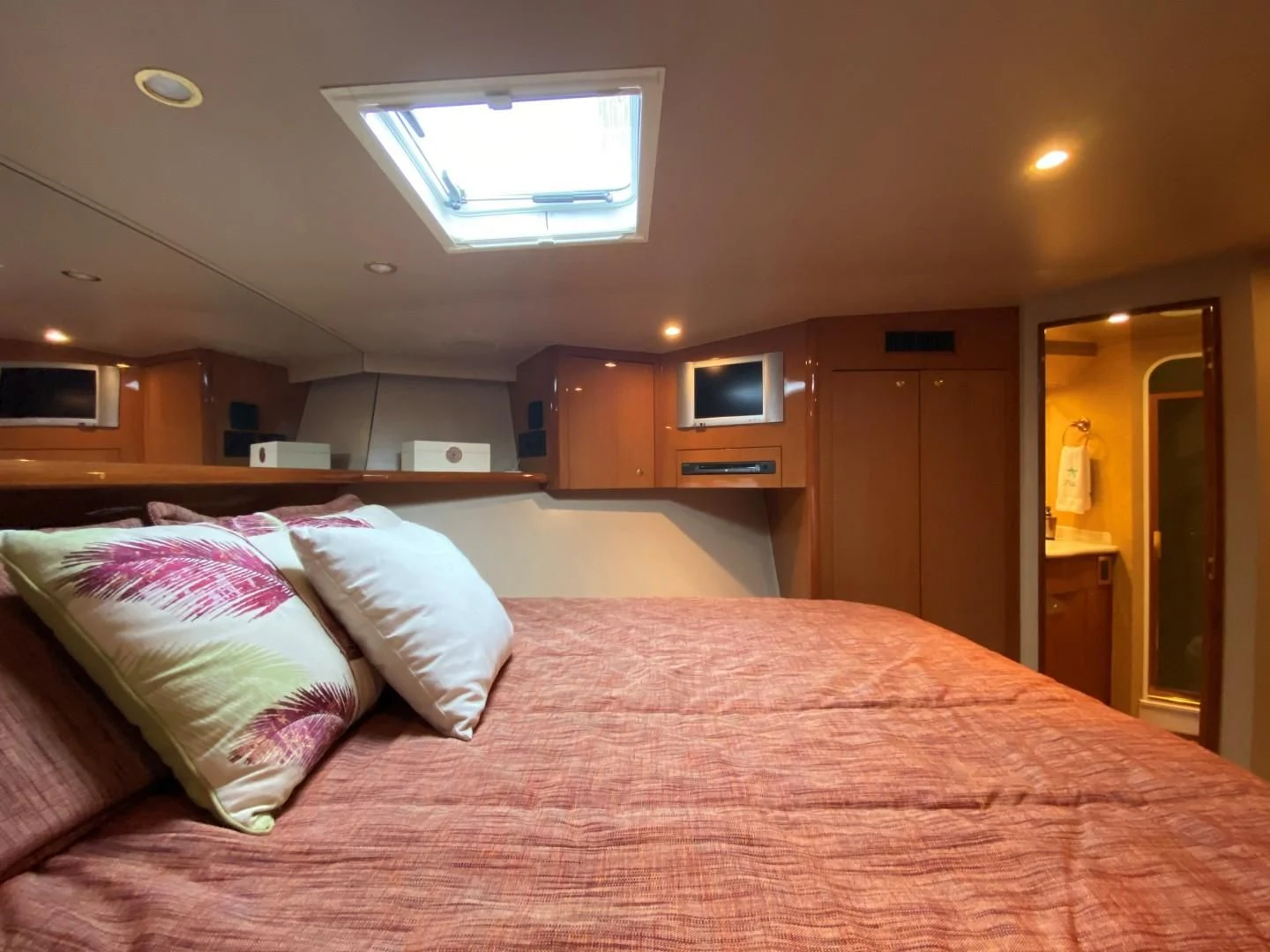 a bed with pink sheets aboard PITTY Yacht for Sale