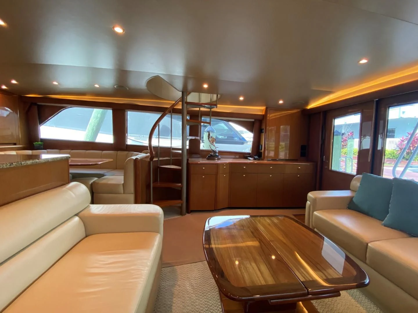 inside of a vehicle with a table and couches aboard PITTY Yacht for Sale