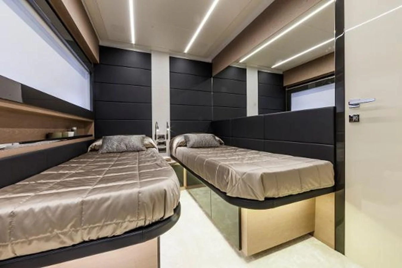 a room with two beds aboard STAR Yacht for Sale