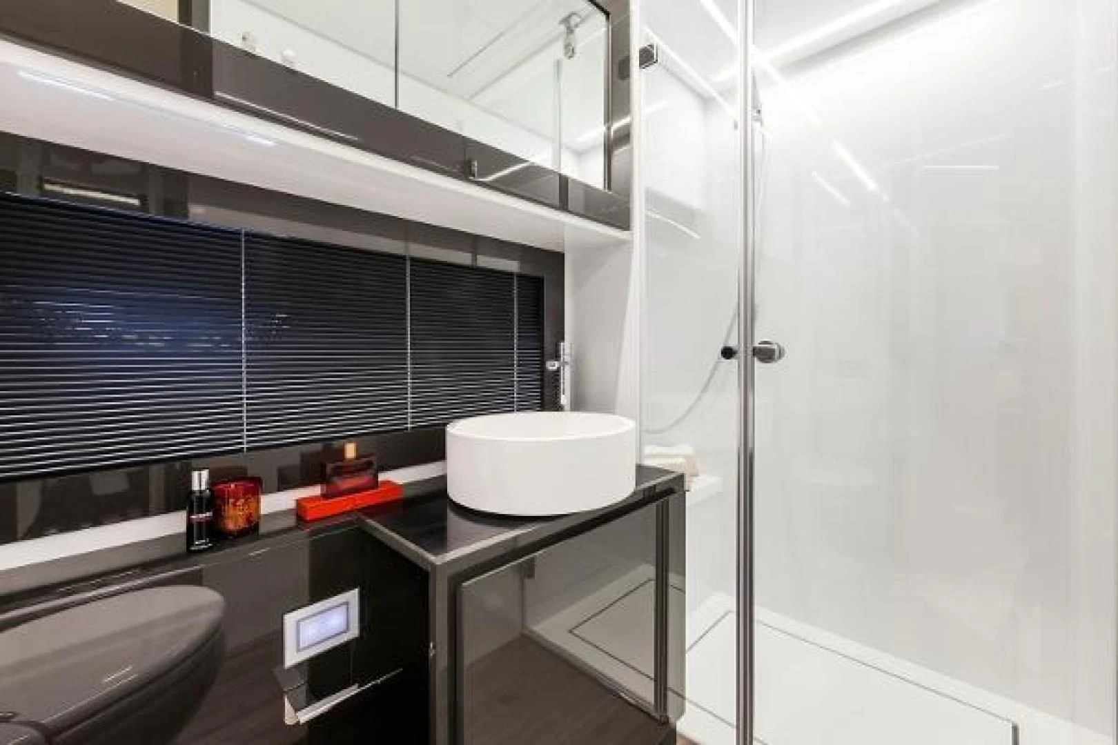 a room with a table and a glass wall aboard STAR Yacht for Sale