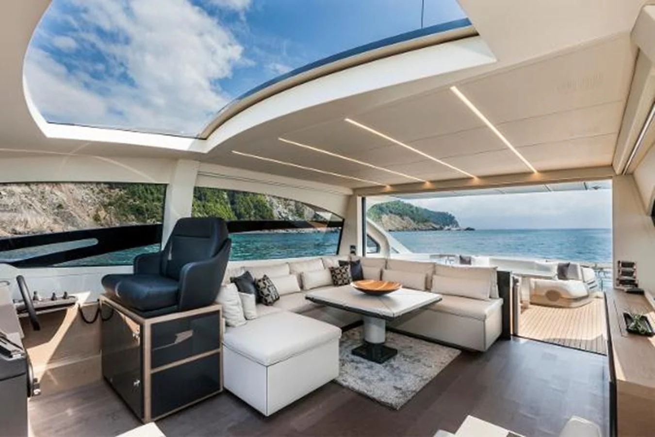 a living room with a large window aboard STAR Yacht for Sale